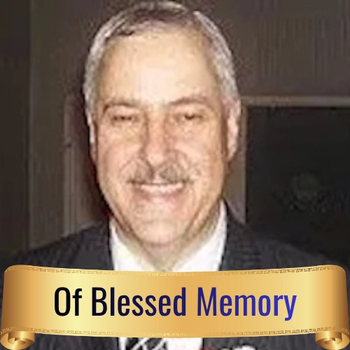 Portrait of Donald Wittenberg with an "Of Blessed Memory" memorial banner, honoring his contributions to Holocaust remembrance and education.