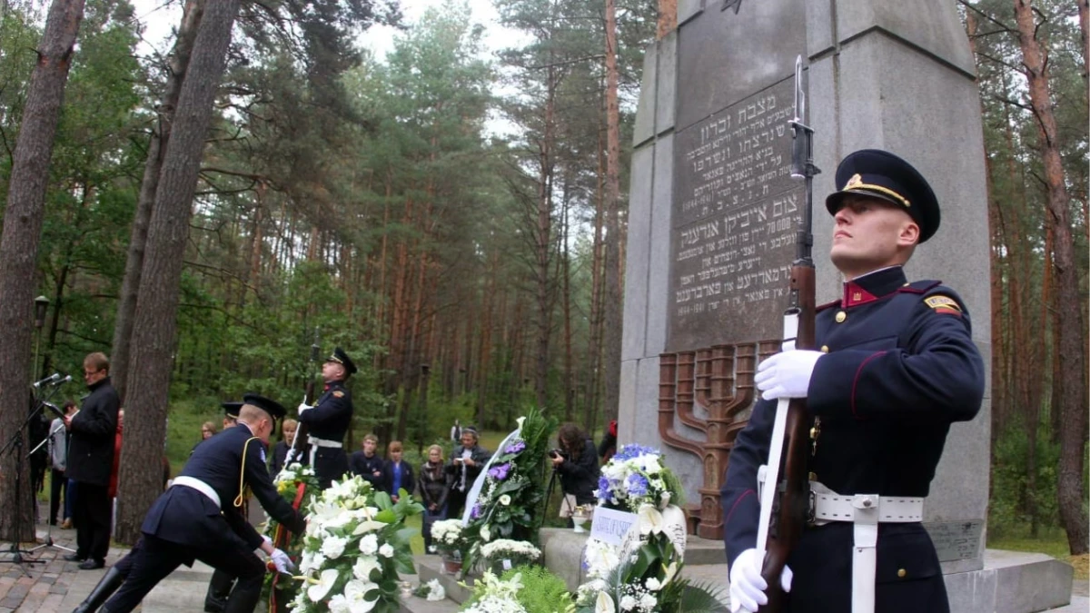 Lithuanian soldiers lay a wreath at Paneriai Holocaust memorial near Vilnius during a Lithuanian-Jewish genocide commemoration ceremony.