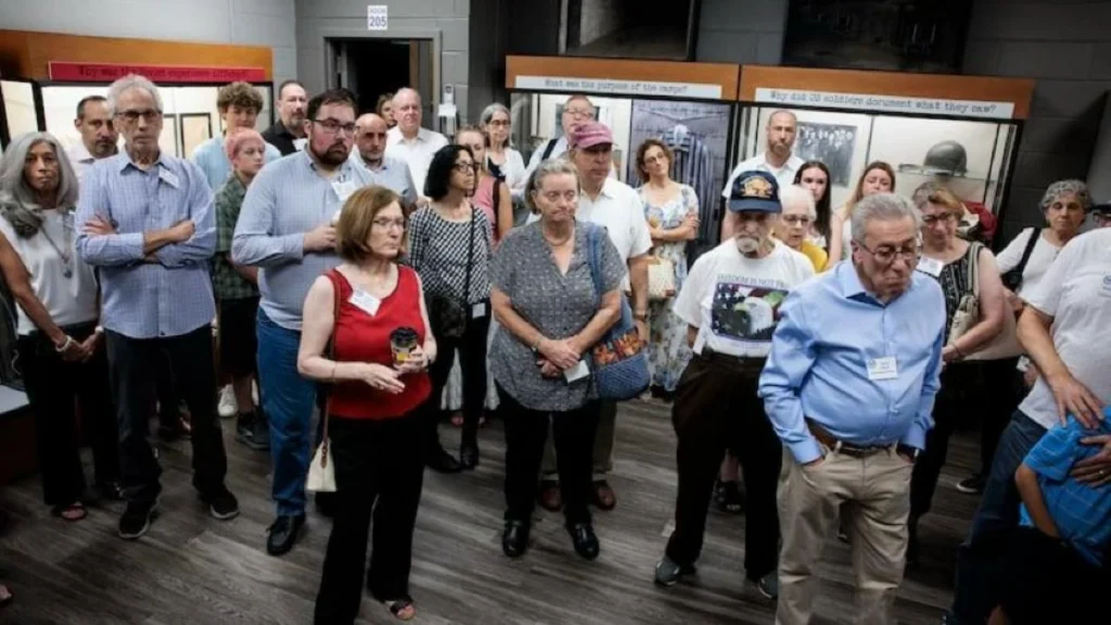 Attendees listen to the dedication ceremony at the Holocaust Awareness Museum