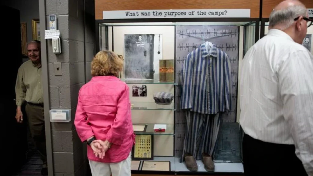 Visitors browse the exhibits during dedication ceremony at the Holocaust Awareness Museum